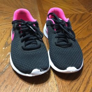 Pink and black nike shoes